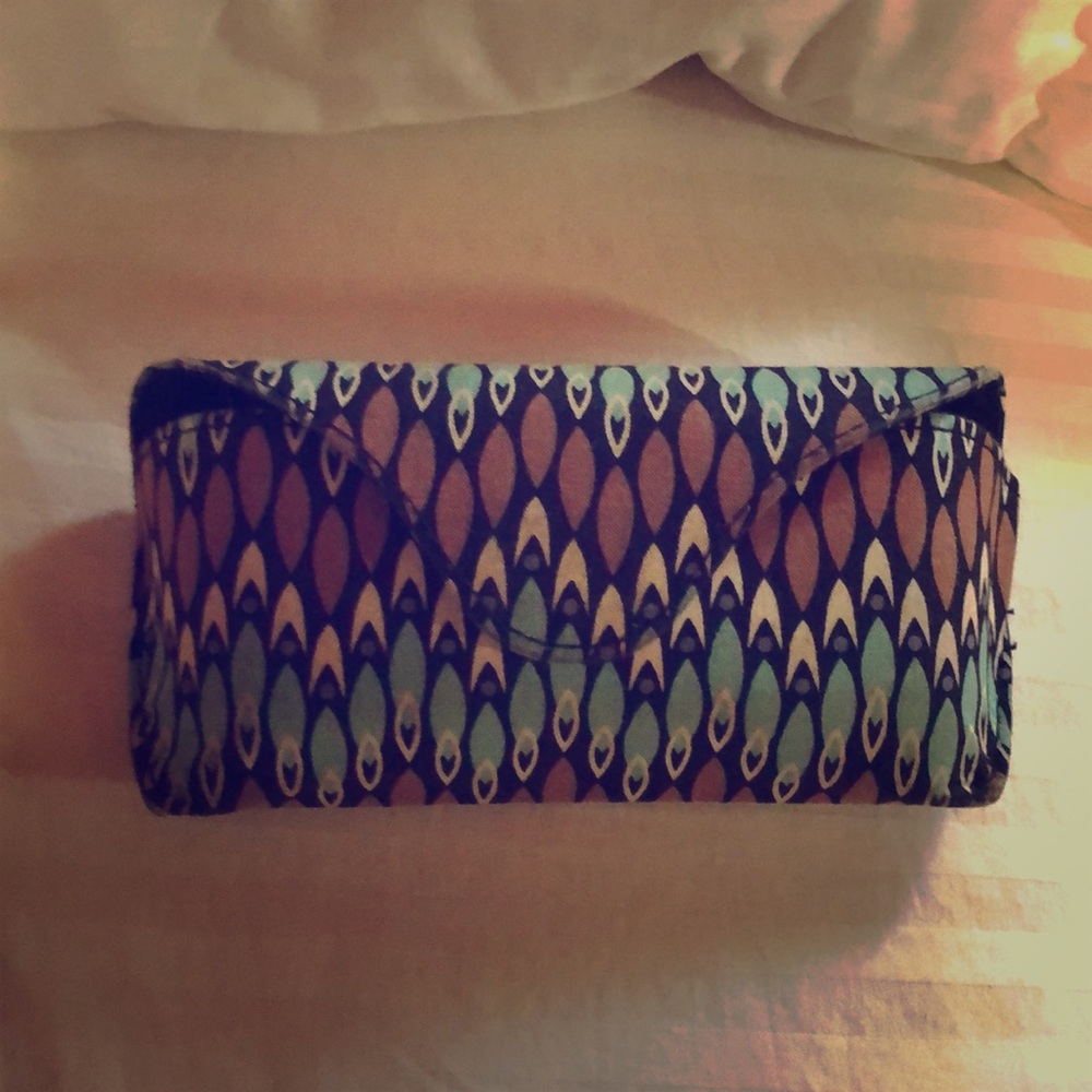 Black, blue, and white glasses case.
